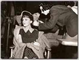 Between scenes from MGM's Madelon, Maureen has her hair fixed by her hairdresser.