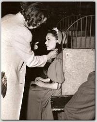 Maureen sits for the hairdresser between scenes in MGM's Hold That Kiss.