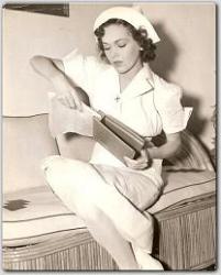 During a break between scenes, Maureen makes an addition to her script for MGM's Between Two Women.