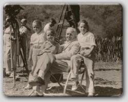 Farrow with his daughters on location